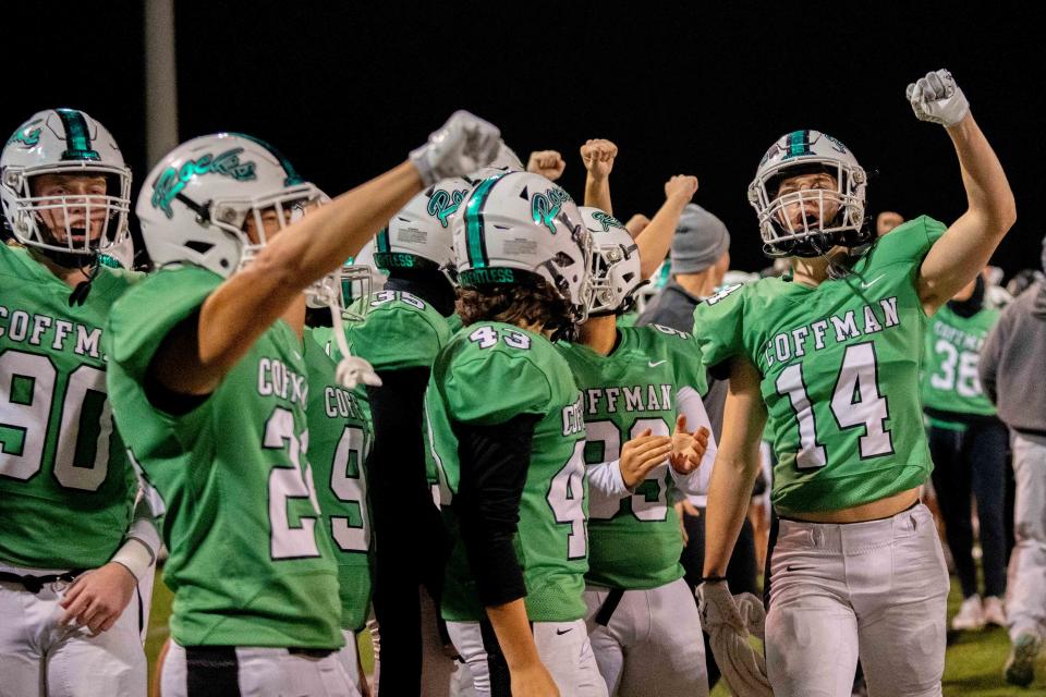 Dublin Coffman's Jack Schwanke (14) hypes up the bench during Friday's game against Springfield.