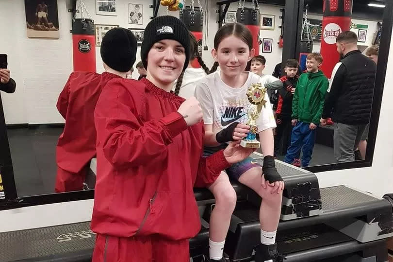 Photo shows Kristina O'Hara-McCafferty with St John Bosco's first ever Girl 1 Irish champion, Erin McComb