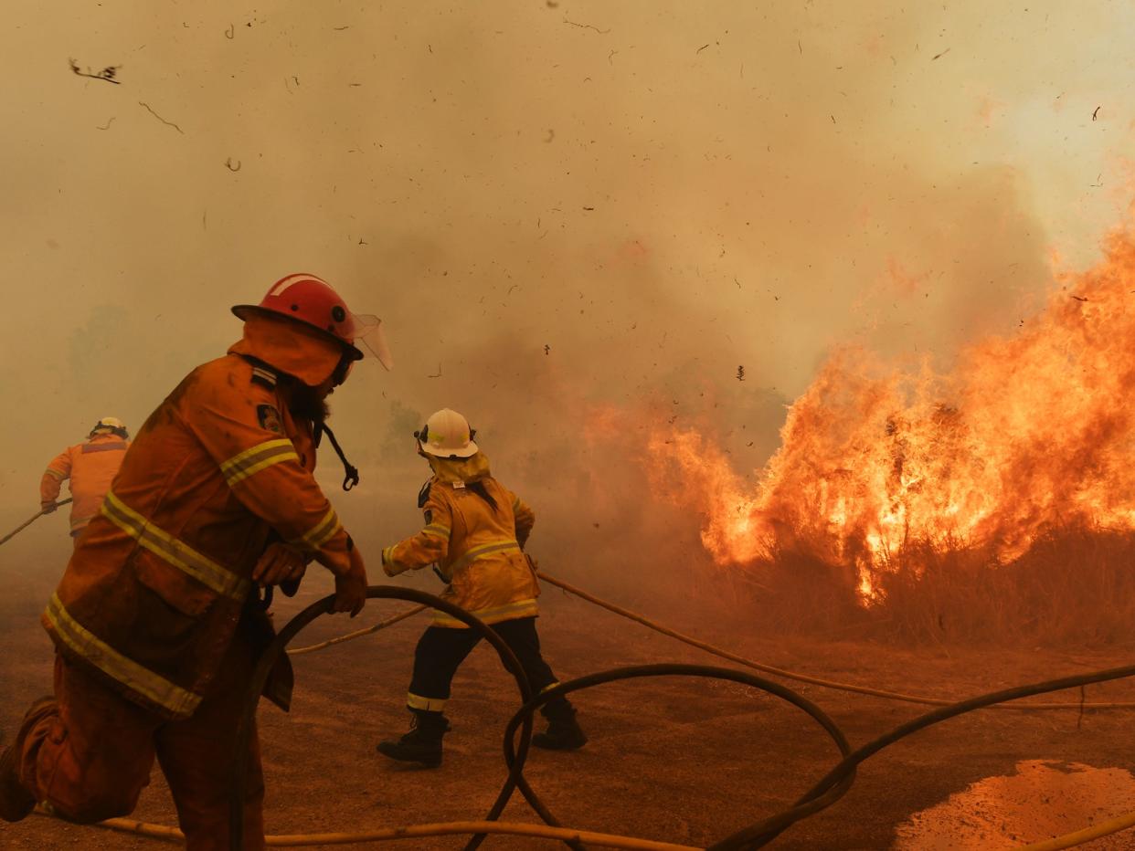 Firefighters battle a spot fire Hillville, Australia: Getty Images