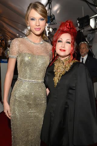 <p>Lester Cohen/WireImage</p> Taylor Swift and Cyndi Lauper in Los Angeles in January 2014