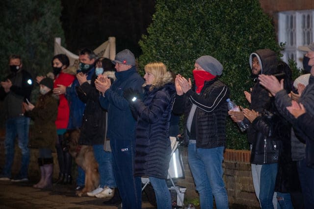 Residents from the village of Marston Moretaine join in with a nationwide clap in honour of Captain Sir Tom Moore, the 100-year-old charity fundraiser who died on Tuesday after testing positive for Covid-19 