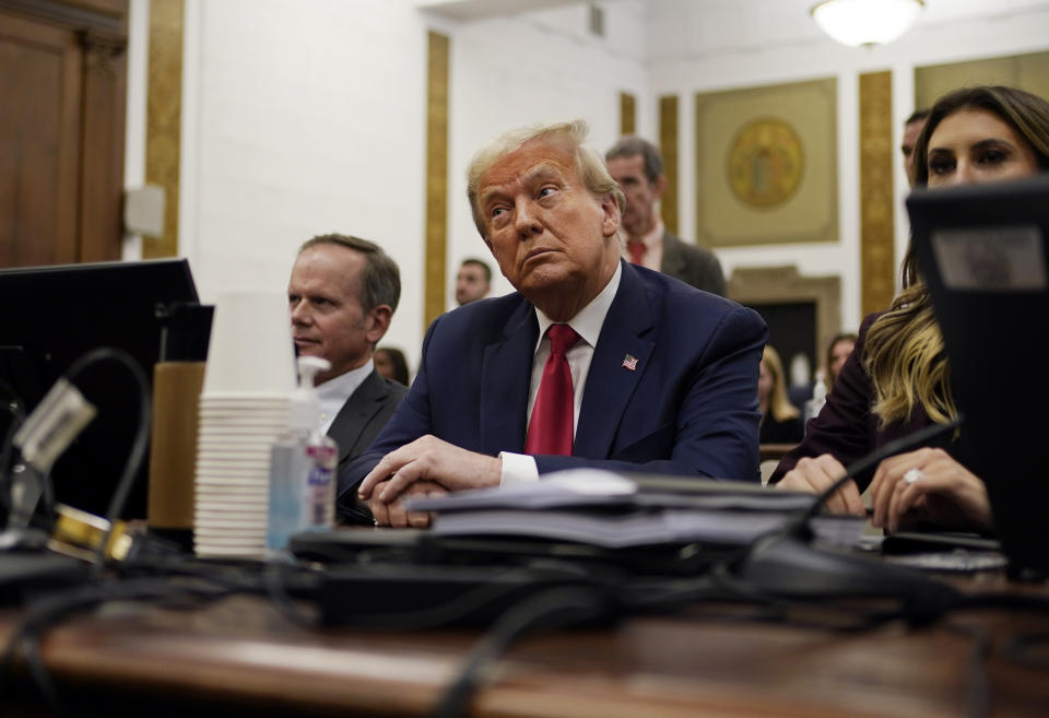 Former President Donald Trump sits in the courtroom with his legal team before the continuation of his civil business fraud trial at New York Supreme Court, Tuesday, Oct. 17, 2023, in New York. (AP Photo/Seth Wenig, Pool)