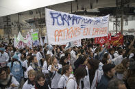 In this photo taken on Dec.17, 2019 medical workers march during a demonstration in Marseille, southern France. In a hospital in Marseille, student doctors are holding an exceptional, open-ended strike to demand a better future. France’s vaunted public hospital system is increasingly stretched to its limits after years of cost cuts, and the interns at La Timone - one of the country’s biggest hospitals - say their internships are failing to prepare them as medical professionals. Instead, the doctors-in-training are being used to fill the gaps. (AP Photo/Daniel Cole)