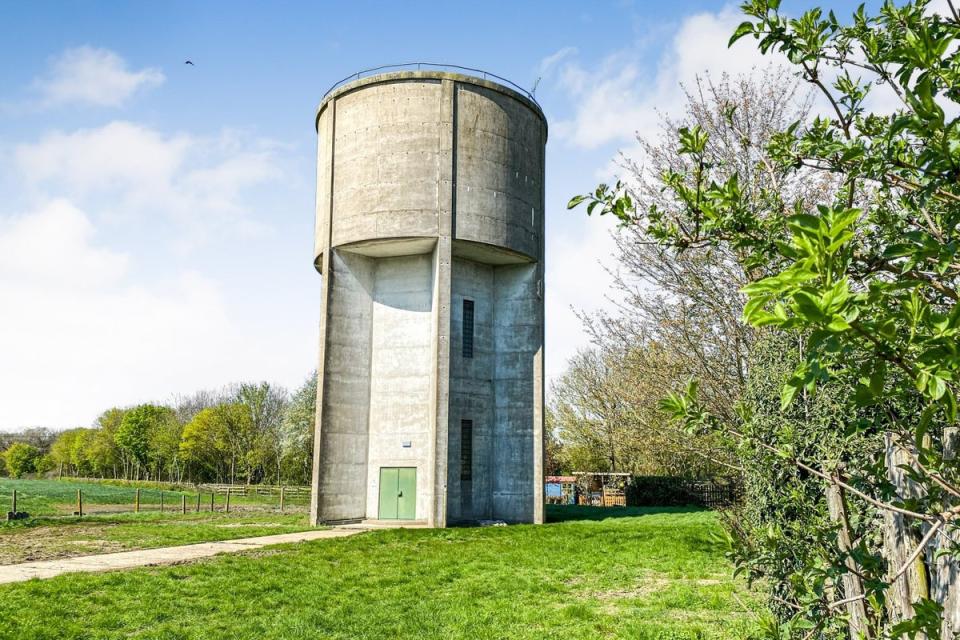 The brutalist concrete tower sits on a 0.32 acre plot (Auction House London)