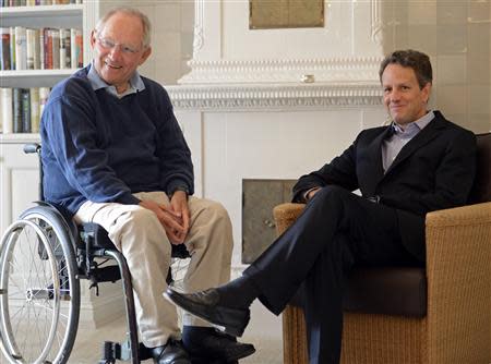 German Finance Minister Wolfgang Schaeuble (L) talks to his U.S. counterpart Timothy Geithner in Westerland on the German island of Sylt in this July 30, 2012 file picture. Reuters/Fabian Bimmer