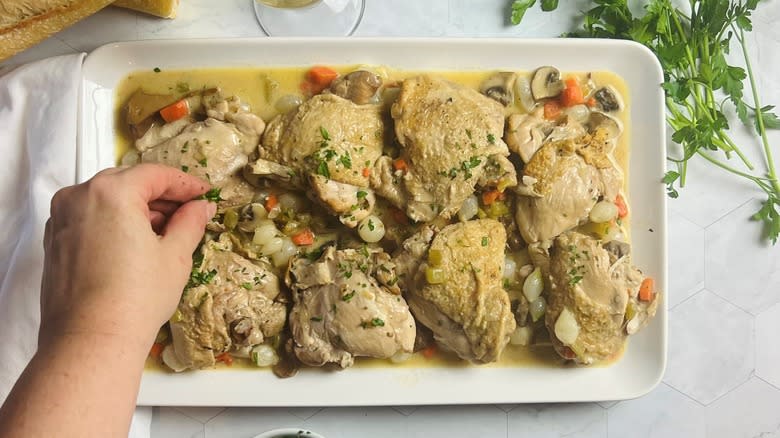 Finished chicken fricassee garnished with parsley