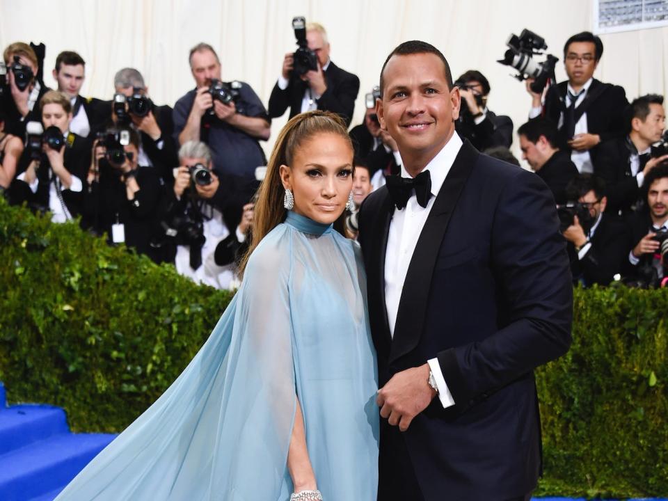 Jennifer Lopez and Alex Rodriguez pose together at an event.