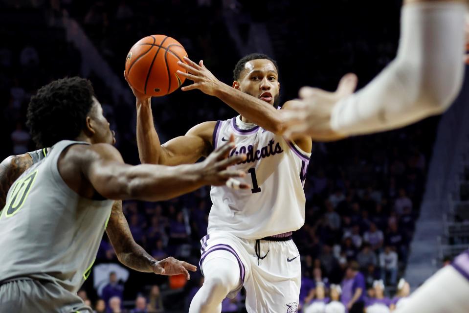 Kansas State point guard Markquis Nowell (1) looks for an open teammate during the second half Tuesday night at Bramlage Coliseum. Nowell had 10 assists and no turnovers in the Wildcats' 75-65 victory.