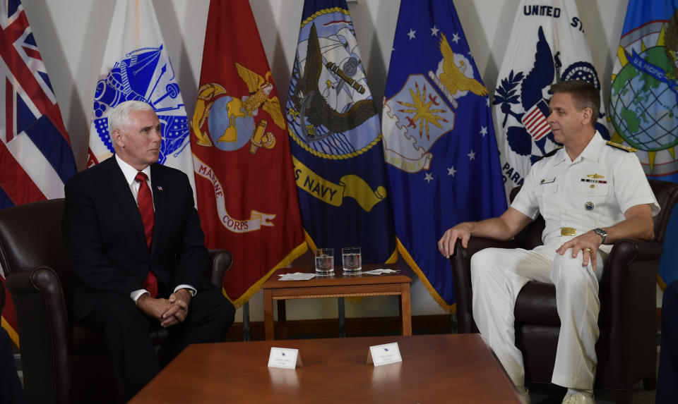 Vice President Mike Pence, left, visits with Commander of U.S. Indo-Pacific Command Admiral Phil Davidson, right, during a visit to Camp H.M. Smith in Hawaii, Wednesday, Aug. 1, 2018. Pence is in Hawaii to speak at a ceremony marking the arrival of the remains believed to be of American service members who fell in the Korean War. North Korea handed over the remains last week.(AP Photo/Susan Walsh)