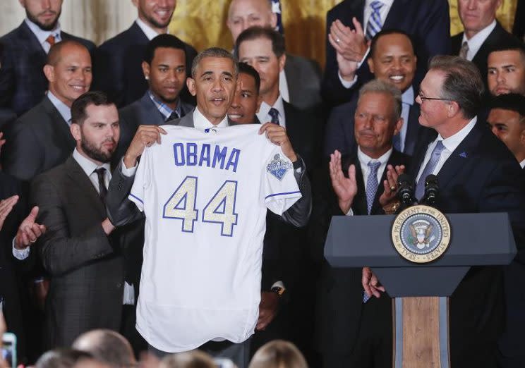 President Barack Obama holds up a personalized Kansas City Royals jersey during their visit to the White House in 2016. (AP)