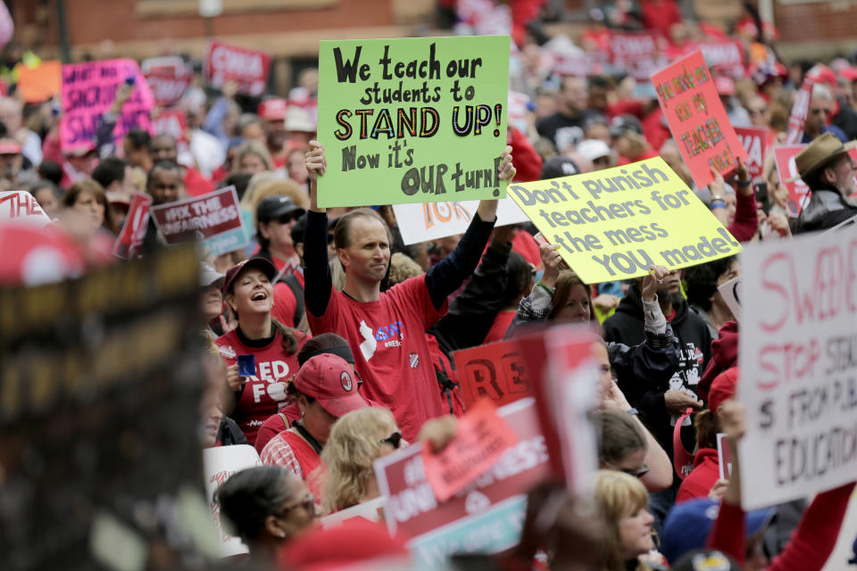 Protesters rally against benefit cuts in Trenton, N.J., Thursday, June 13, 2019. Spurred on by a tweet from U.S. Sen. Bernie Sanders, thousands of union members crowded around New Jersey's legislative annex Thursday, even spilling into the street, to protest state Senate President Steve Sweeney's calls to cut some worker benefits. (AP Photo/Seth Wenig)