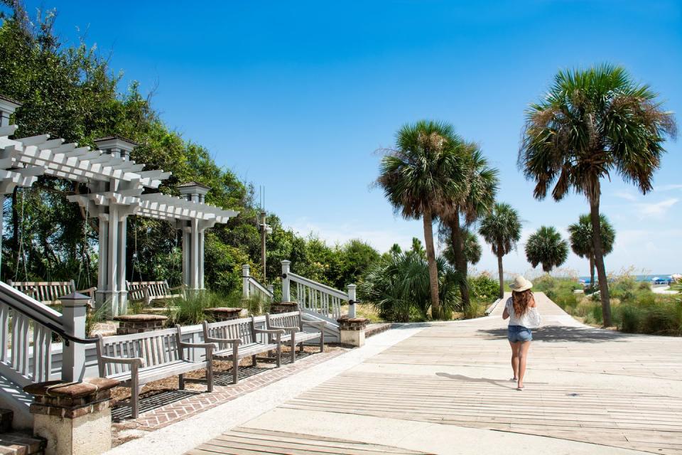 a person walking on a boardwalk