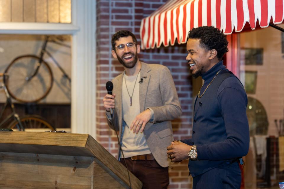 The Coalition Series co-founders Jacob Smith, left, and Brandon Christopher laugh while addressing attendees at a dinner event in Detroit on Feb. 3, 2023.