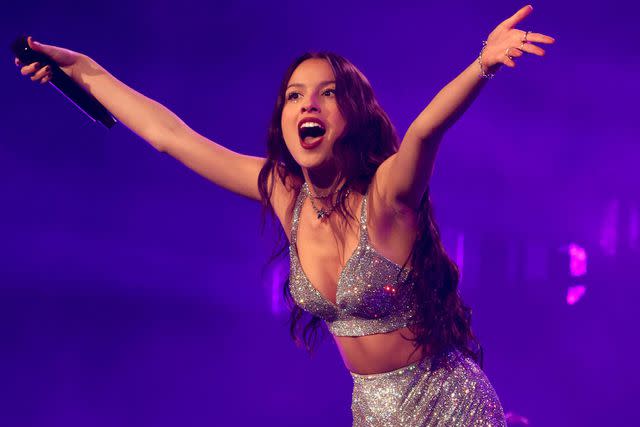 <p>Kevin Mazur/Getty</p> Olivia Rodrigo performing during opening night of her Guts World Tour on Feb. 23, 2024 in Palm Springs, California.