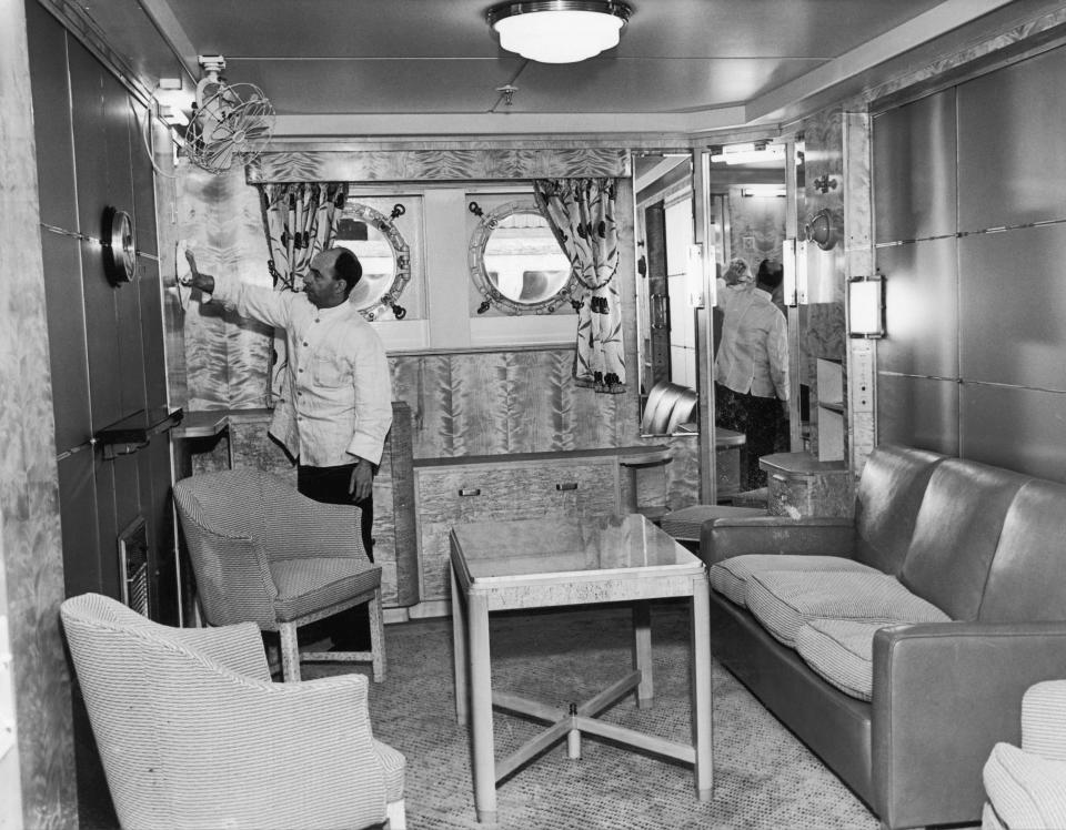 A cabin class private lounge of the Mauretania receives a final polish.