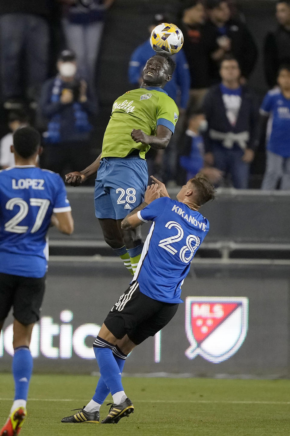 Seattle Sounders defender Yeimar Gomez (28) goes up for a header against San Jose Earthquakes forward Benji Kikanovic (28) during the first half of an MLS soccer match Wednesday, Sept. 29, 2021, in San Jose, Calif.(AP Photo/Tony Avelar)