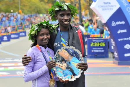 Nov 1, 2015; New York, NY, USA; Stanley Biwott (right) poses with Mary Keitany after winning their divisions during the 2015 TCS New York City Marathon. Mandatory Credit: Derik Hamilton-USA TODAY Sports