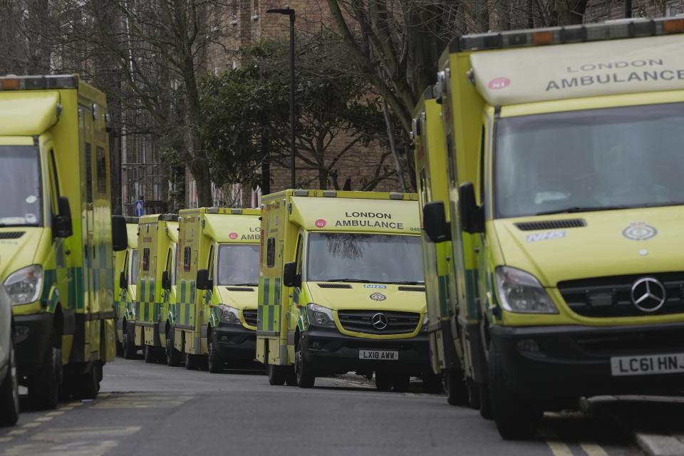 Ambulances park as the workers take part in a strike in London, Wednesday, Jan. 11, 2023. Around 25,000 U.K. ambulance workers went on strike Wednesday, walking out for the second time since December in an ongoing dispute with the government over pay. (AP Photo/Kin Cheung)