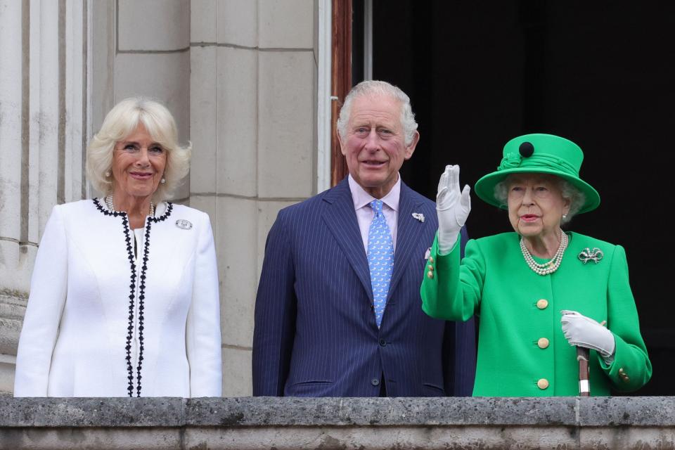 Prince Charles, Prince of Wales, stands alongside Queen Elizabeth II, right, and Camilla, Duchess of Cornwall, on  the balcony of Buckingham Palace at the end of the Platinum Pageant on June 5, 2022.