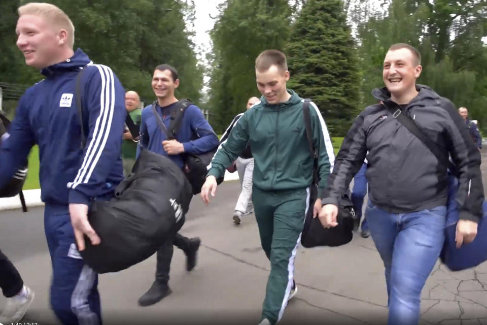 In this photo made from footage provided by the Russian Defense Ministry on Wednesday, July 15, 2020, a group of volunteers participating in a trial of a coronavirus vaccine leave the Budenko Main Military Hospital outside Moscow, Russia. Russia is boasting that it’s about to be the first country to approve a COVID-19 vaccine, but scientists worldwide are sounding the alarm that the headlong rush could backfire. (Russian Defense Ministry Press Service via AP)