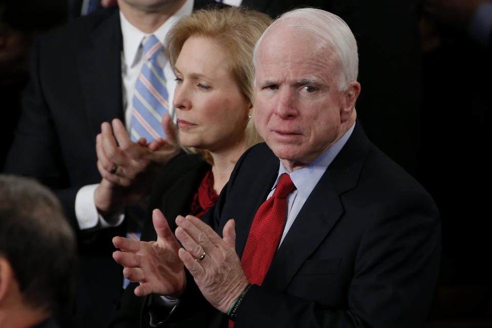 Sen. Kirsten Gillibrand, D-N.Y., and Sen. John McCain, R-Ariz. applaud President Barack Obama's State of the Union address on Capitol Hill in Washington, Tuesday Jan. 28, 2014. (AP Photo/Charles Dharapak)