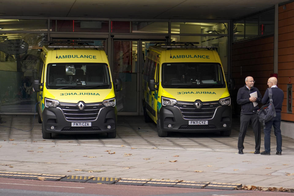 Ambulances are parked outside St Thomas' Hospital, in London, Thursday, Dec. 1, 2022. Some 10000 ambulance staff have voted to strike over pay and working conditions, along with a possible 100,000 nurses going on strike on Dec1. 5, leading the Government to set up contingency plans to cope with a wave of walkouts with Cabinet Minister Oliver Dowden in charge. (AP Photo/Alberto Pezzali)