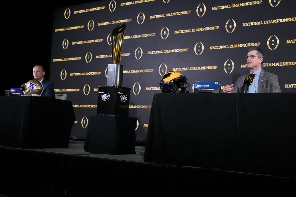 Washington head coach Kalen DeBoer, left, and Michigan head coach Jim Harbaugh participate during a news conference ahead of the national championship NCAA College Football Playoff game between Washington and Michigan Sunday, Jan. 7, 2024, in Houston. The game will be played Monday. (AP Photo/Godofredo A. Vasquez)