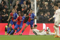 Crystal Palace's Tyrick Mitchell, centre, celebrates after scoring his side's third goal during the English Premier League soccer match between Crystal Palace and Manchester United at Selhurst Park stadium in London, England, Monday, May 6, 2024. (AP Photo/Ian Walton)