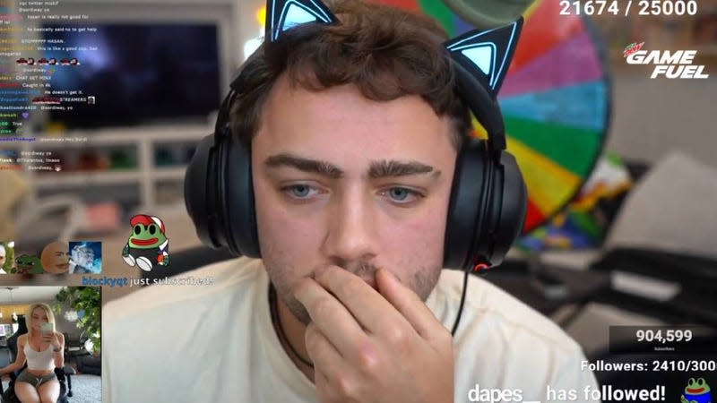 Mizkif sits on his stream with cat ears.