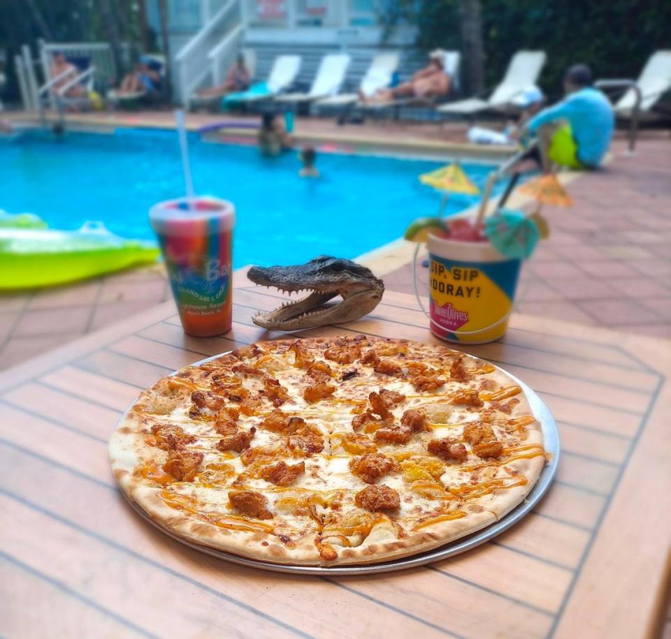 “The Florida Man” pizza at the World Famous Tiki Bar at Lighthouse Resort Inn & Suites in Fort Myers Beach is made with homemade “special Trailer Sauce” and is topped with fried gator and banana peppers.