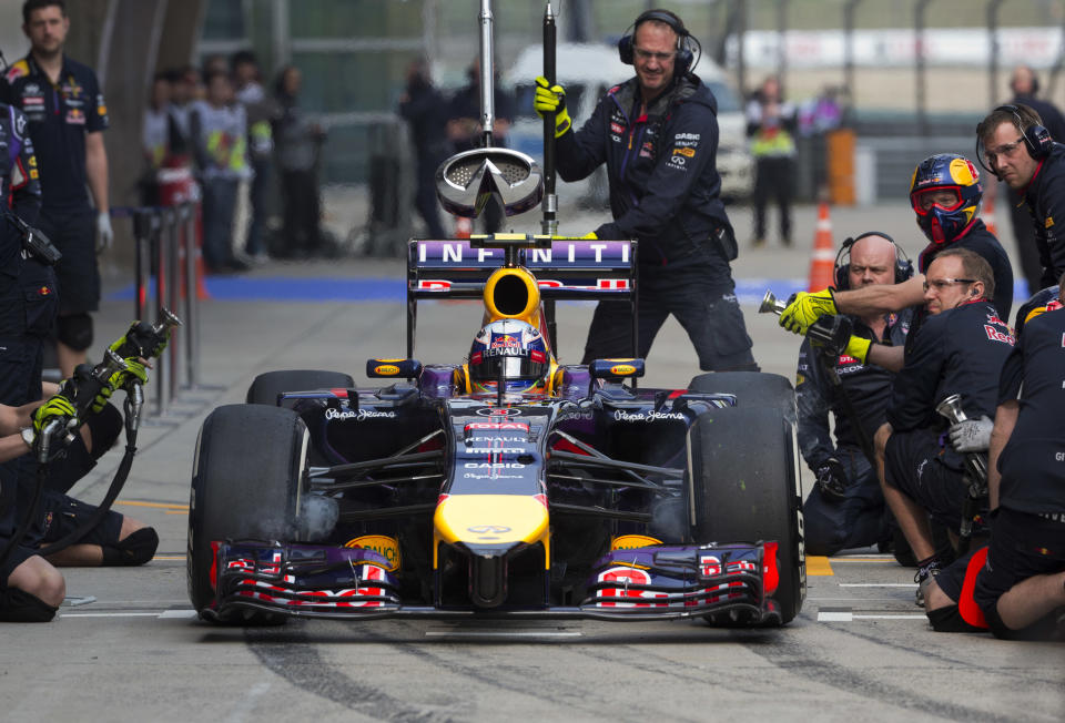 Red Bull driver Daniel Ricciardo of Australia drives out from the pit-lane during the practice session ahead of Sunday's Chinese Formula One Grand Prix at Shanghai International Circuit in Shanghai, China Friday, April 18, 2014. (AP Photo/Andy Wong)