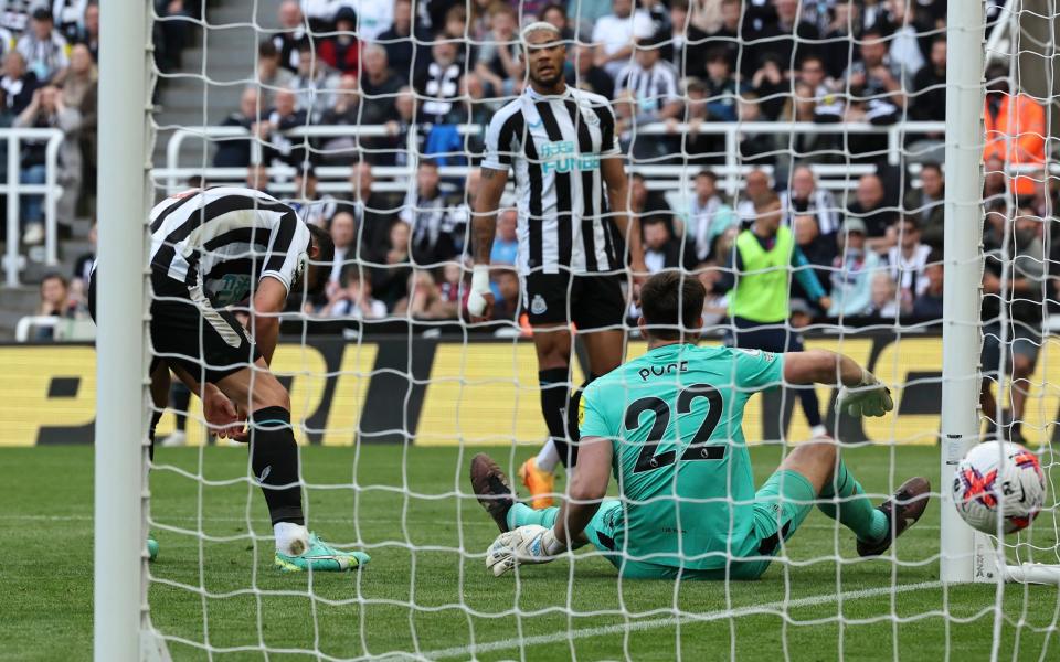 Newcastle United's Fabian Schar scores an own goal beating with team-mate Nick Pope - AP