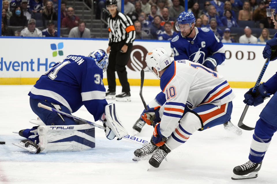 Edmonton Oilers center Derek Ryan (10) watches his goal get past Tampa Bay Lightning goaltender Jonas Johansson (31) during the first period of an NHL hockey game Saturday, Nov. 18, 2023, in Tampa, Fla. (AP Photo/Chris O'Meara)