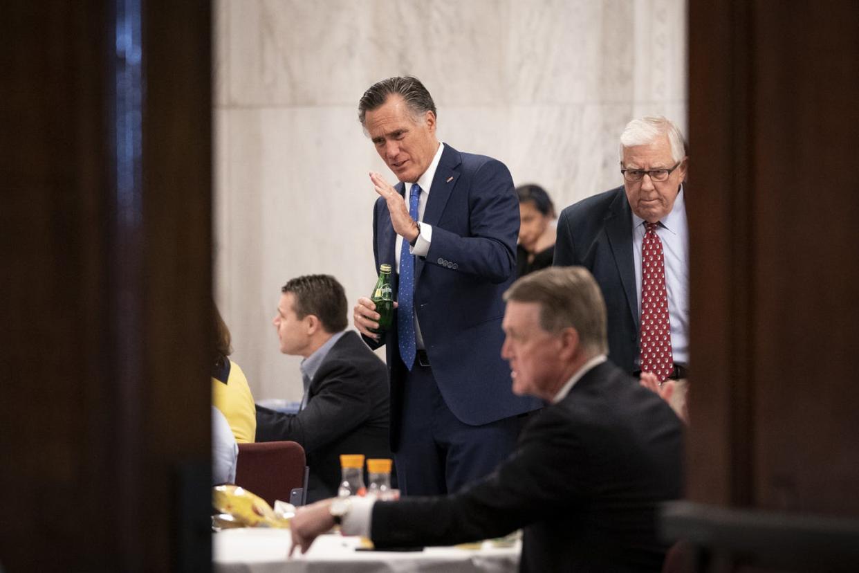 <span class="caption">Sen. Mitt Romney, R-Utah, at a Senate GOP lunch meeting on March 20, 2020, to discuss the 'phase 3' coronavirus stimulus bill. </span> <span class="attribution"><a class="link " href="https://www.gettyimages.com/detail/news-photo/sen-mitt-romney-speaks-as-he-attends-a-senate-gop-lunch-news-photo/1207849533?adppopup=true" rel="nofollow noopener" target="_blank" data-ylk="slk:Getty/ Drew Angerer;elm:context_link;itc:0;sec:content-canvas">Getty/ Drew Angerer</a></span>