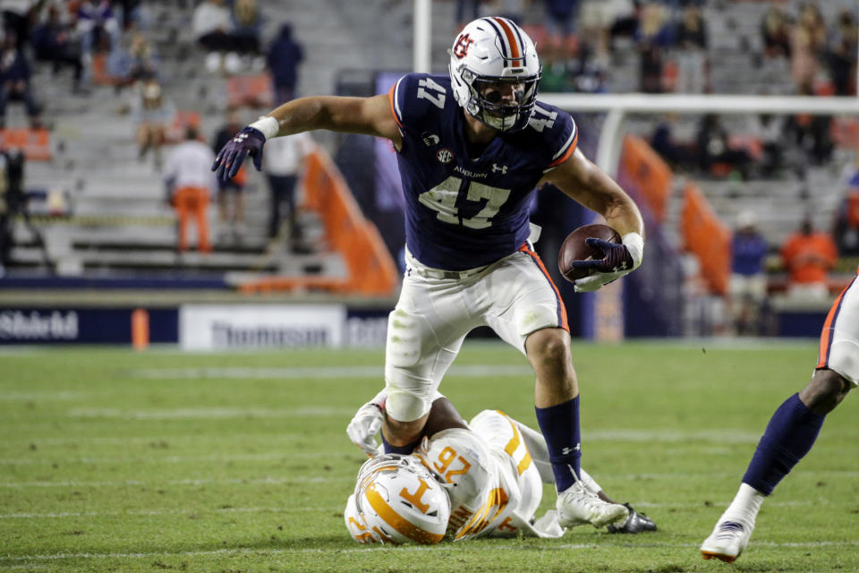 Auburn tight end John Samuel Shenker (47) is tackled by Tennessee defensive back Theo Jackson (26) after a reception during the second half of an NCAA college football game Saturday, Nov. 21, 2020, in Auburn, Ala. (AP Photo/Butch Dill)