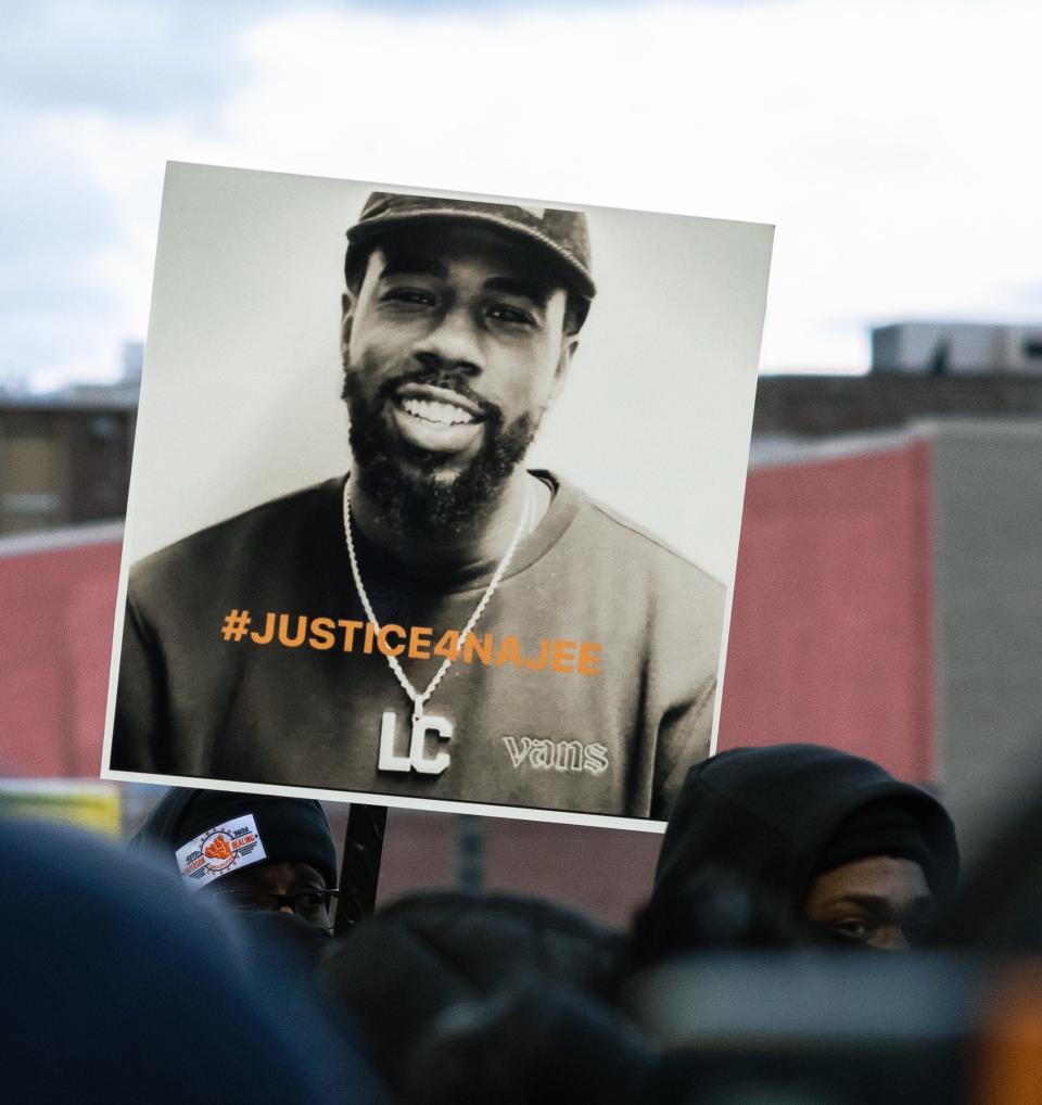 A demonstrator holds a #justicefornajee sign during a recent demonstration following the fatal police shooting of Najee Seabrooks on March 3, 2023 in Paterson, New Jersey.