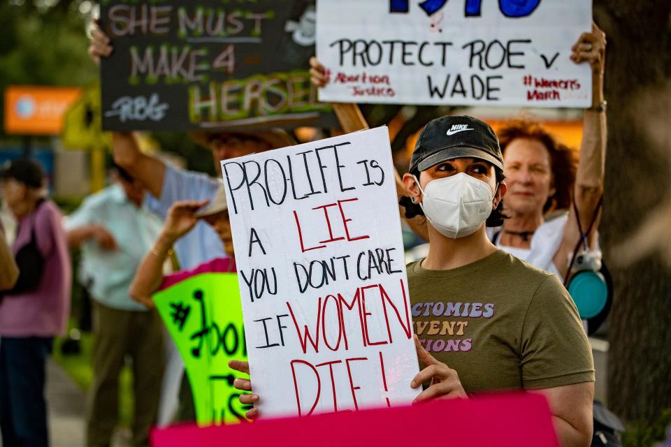 Protesters demonstrate against the Supreme Court decision overturning Roe V Wade on South Florida Avenue in Lakeland on Friday.