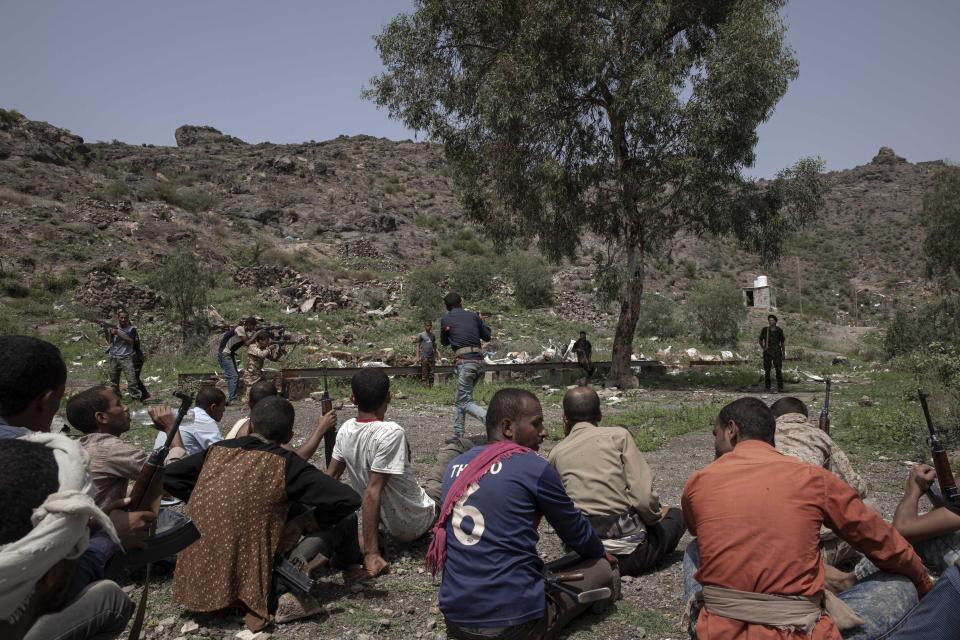 In this Monday, Aug. 5, 2019 photo, fighters from a militia known as the Security Belt, that is funded and armed by the United Arab Emirates, train at a base in Yemen's Dhale province. Yemen’s civil war has been deadlocked for months, with neither side making major gains. At one of the most active front lines, militiamen backed by the Saudi-led coalition are dug in, exchanging shelling every night with Iranian-allied Houthi rebels only a few hundred meters away. (AP Photo/Nariman El-Mofty)