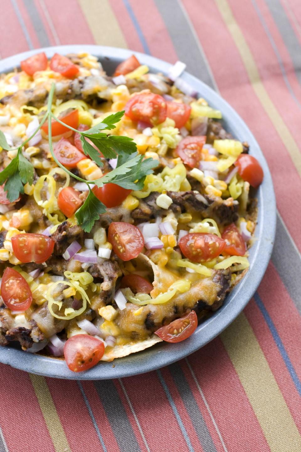 In this image taken on June 10, 2013, corn and steak grilled nachos are shown in Concord, N.H. (AP Photo/Matthew Mead)