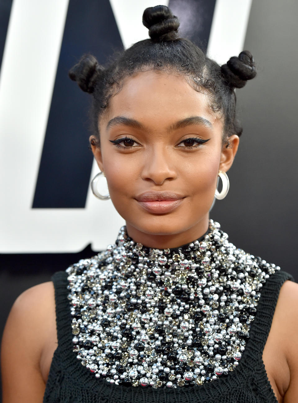 <p>The 18-year-old attended the premiere of <em>BlacKkKlansman</em> in Beverly Hills, Calif., sporting beautiful Bantu knots that accentuated her winged eyeliner and barely-there foundation. <strong>Pro tip: Use <a rel="nofollow noopener" href="https://www.walmart.com/ip/Goody-Ouchless-Elastics-75-count/10319772" target="_blank" data-ylk="slk:Goody Ouchless Elastics;elm:context_link;itc:0;sec:content-canvas" class="link ">Goody Ouchless Elastics</a> in clear to keep topknots in place. </strong>(Photo: Getty Images) </p>