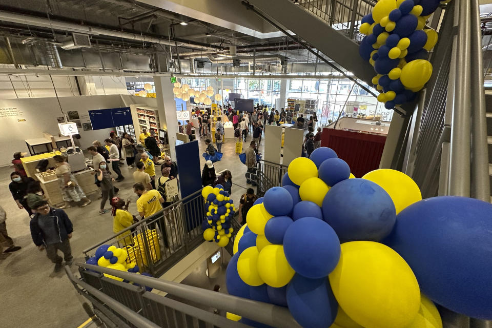 Shoppers make their way through the new IKEA store along Market Street on its opening day in San Francisco, Wednesday, Aug. 23, 2023. Thousands of CEOs, press, world leaders, protesters and others will descend on San Francisco for a global trade summit that could give the much maligned city a chance to shine. Boosters point to furniture giant IKEA, which opened in late August on a troubled block of downtown, and an emerging AI industry. (AP Photo/Eric Risberg)