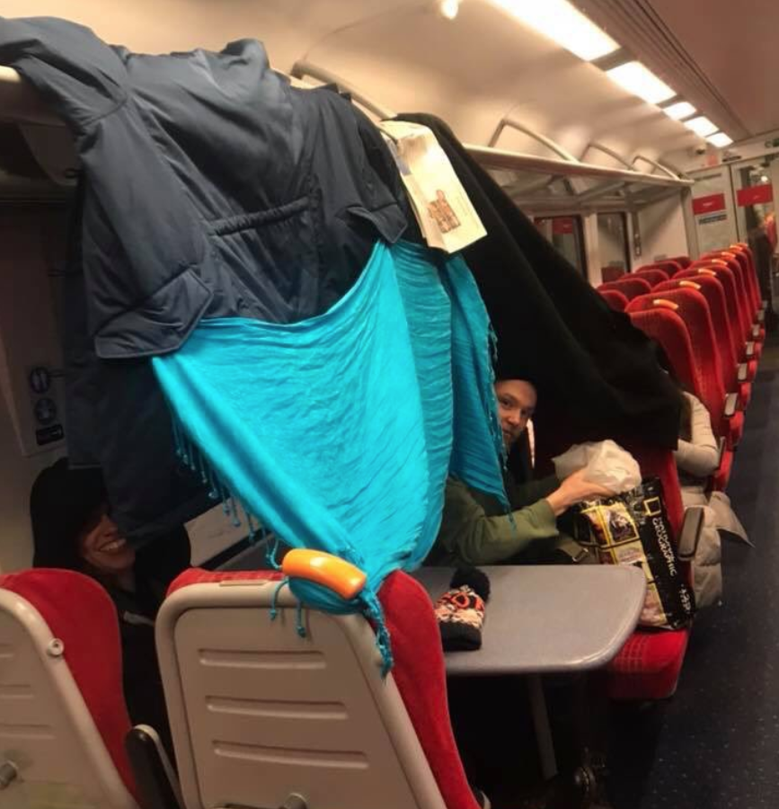 Passengers trying to keep warm on the south coast-bound train