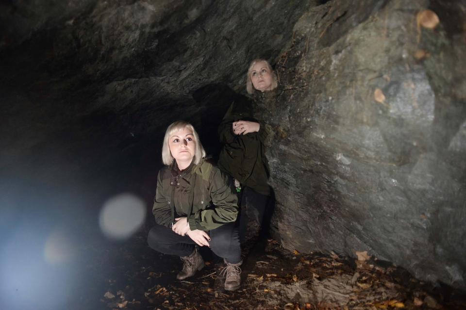 This multiple exposure photograph of Taunton Daily Gazette staff reporter Susannah Sudborough was taken inside King Philip's Cave in Norton, said to be a Bridgewater Triangle hot spot, on Tuesday, Oct. 20, 2020.