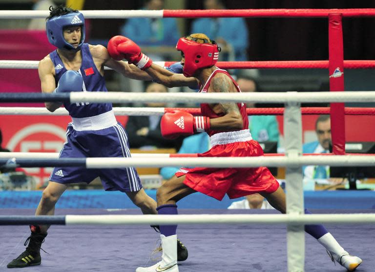 Zou Shiming (L) last fought against Amnat Ruenroeng when they were both amateurs at the Asian Games in Guangzhou, pictured here on November 24, 2010