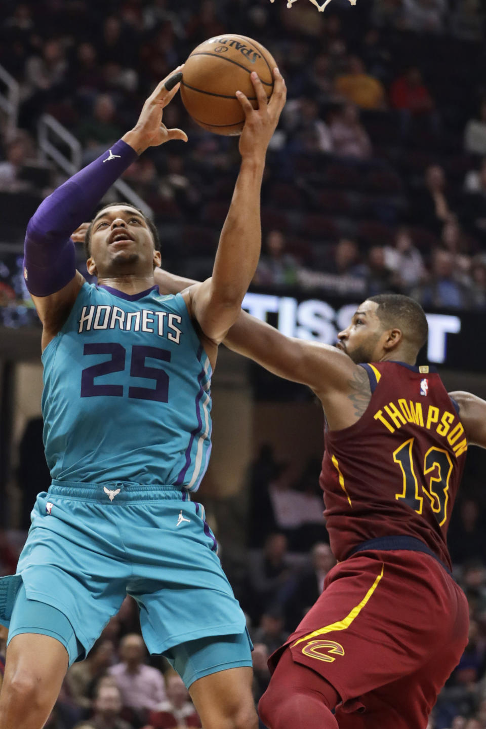 Charlotte Hornets' PJ Washington (25) drives to the basket against Cleveland Cavaliers' Tristan Thompson (13) in the second half of an NBA basketball game, Thursday, Jan. 2, 2020, in Cleveland. (AP Photo/Tony Dejak)