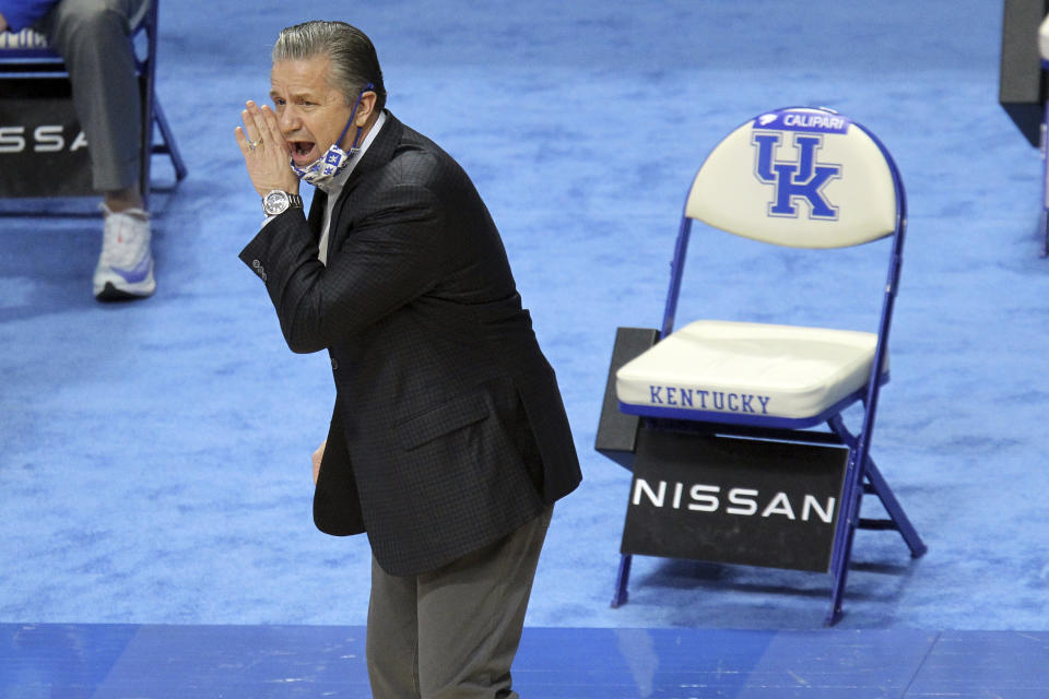 Kentucky head coach John Calipari yells to his team during the first half of an NCAA college basketball game against LSU in Lexington, Ky., Saturday, Jan. 23, 2021. (AP Photo/James Crisp)