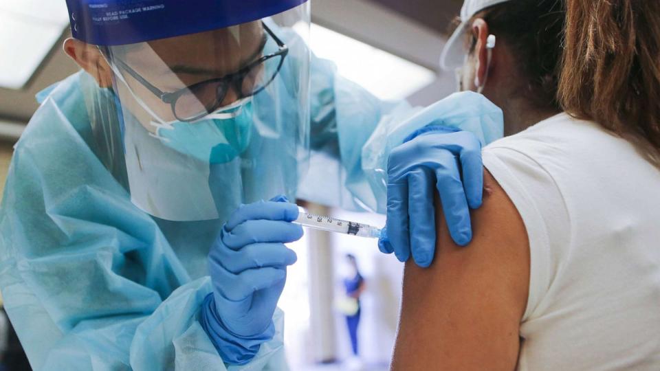 PHOTO: A nurse administers a flu vaccination shot to a woman at a free clinic, Oct. 14, 2020, in Lakewood, Calif.  (Mario Tama/Getty Images, FILE)