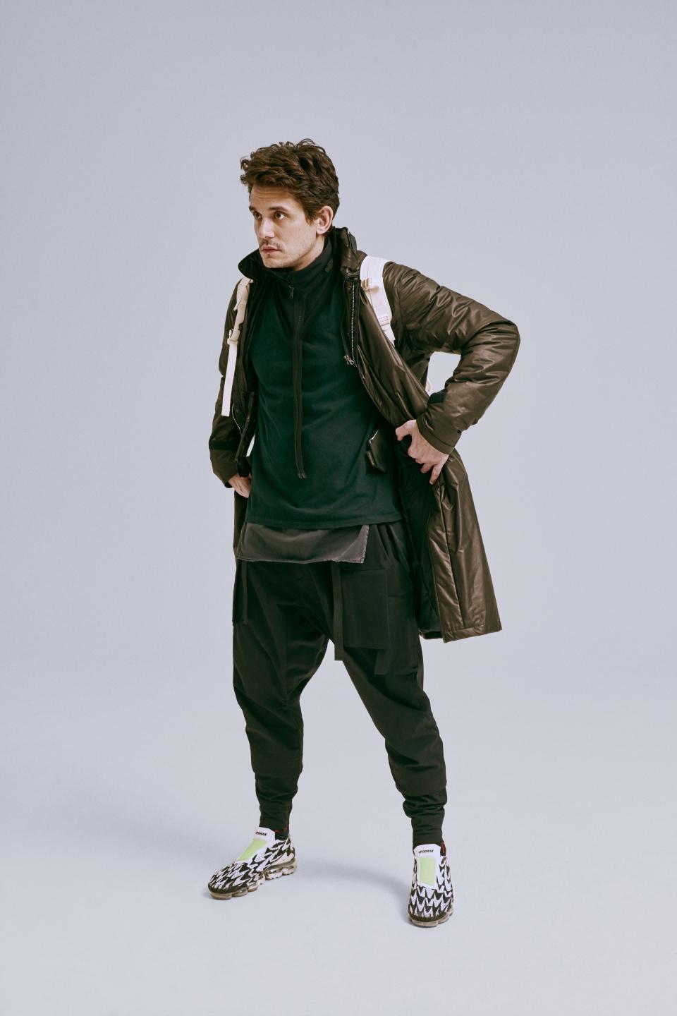 <cite class="credit">J46-FO 2L coat (2018), 3A-SR1 Third Arm Suspensor Harness, S8-C Object Dyed tank top (S/S '15), NG9-PS Modular zippered neck gaiter, and P23A-DS cargo drawcord trouser (F/W '17/'18), by Acronym / Jumbo tee, and Cordura 20L backpack (2018), by Visvim / Air Vapormax Moc 2 x Acronym sneakers, by Nike x Acronym</cite>