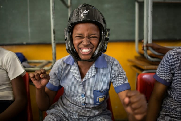 Phumzile Mapisa, 12, wears a helmet during a training session at her school in Sowete with Action Breaks Silence, an NGO which empowers women and girls to defend themselves against rape and sexual violence