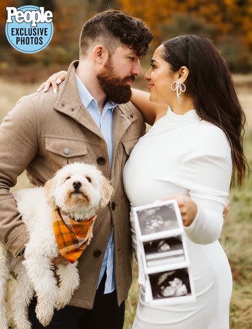 <p>Kelly Lemon Photography</p> Zack Goytowski and Bliss Poureetezadi Goytowski showing off the ultrasound of their first child